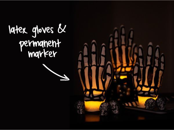 Skeleton Hands Made from Latex Gloves.  Create the spooky skeleton lights by drawing a bones with a sharpie on latex gloves.  Then