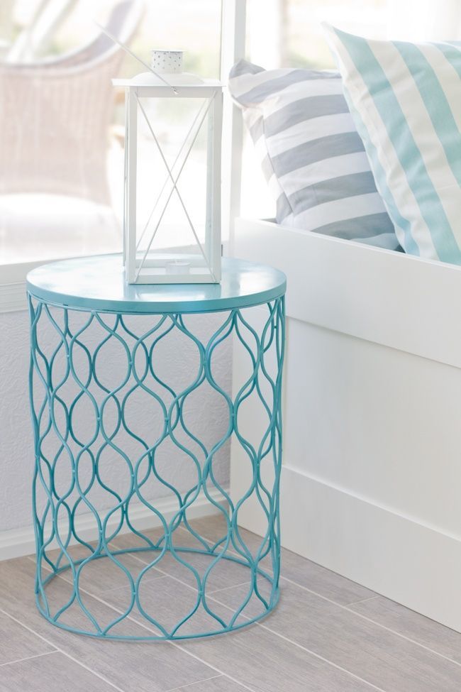 spray paint a cute, wire trash can turn it upside down = side table