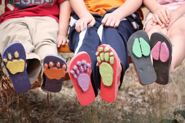 Transform flipflops into animal track shoes using a hot glue gun and sheets of colored craft foam.