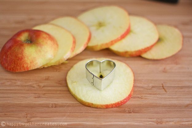 Use a small cookie cutter to core the center of apple slices. | 47 Unexpected Things To Do With Cookie Cutters