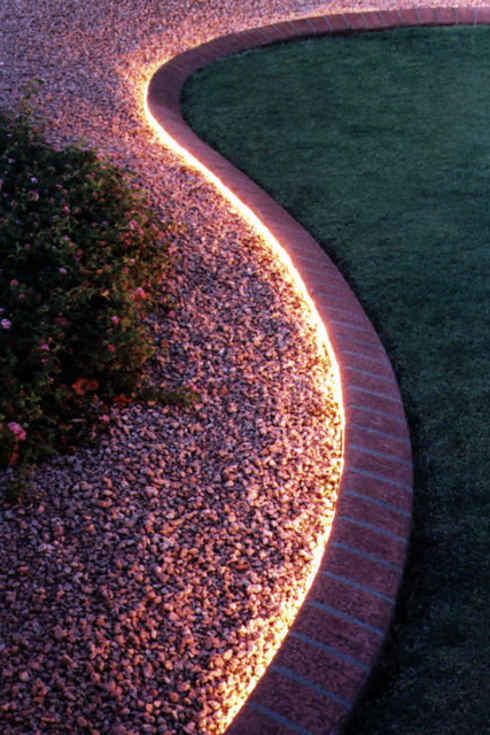 Use rope lighting to line your garden | 51 Budget Backyard DIYs That Are Borderline Genius