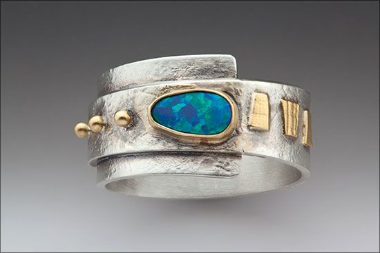 Wrap Around It, ring by Linda Lewis: Opal, sterling silver and 22k gold.   Hand fabricated from sterling sheet and textured with