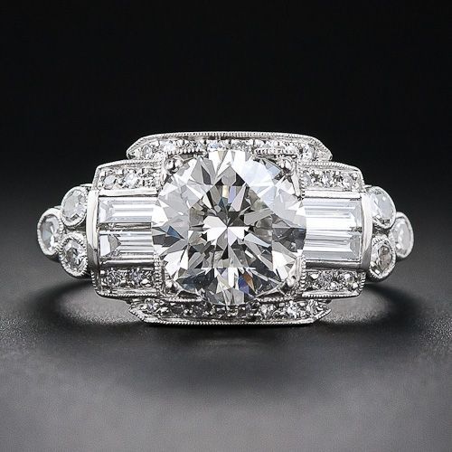 A consummate late-Art Deco platinum and diamond engagement ring blazing front and center with a gorgeous and glistening