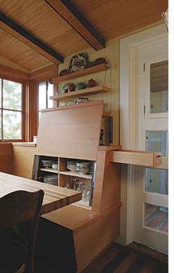 Amazing hidden storage within dining bench.  Follow link to see appearance when closed (Arkin Tilt Architects)