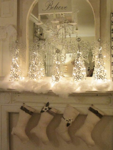 Christmas mantel (from Junk Chic Cottage)  love the idea of a mirror behind to pick up and enhance the glow