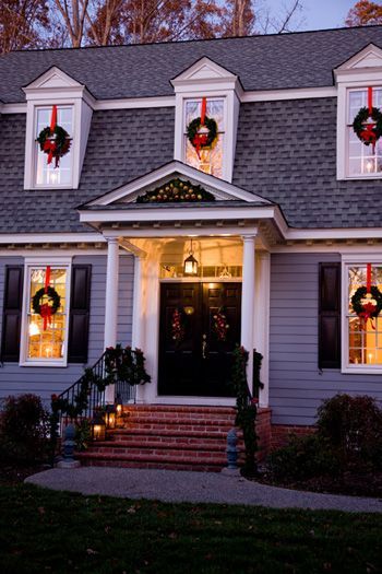 Classic xmas  this is our look for 20 years, wreath hanging on the red ribbon with a red bow and a lighted candle inside the