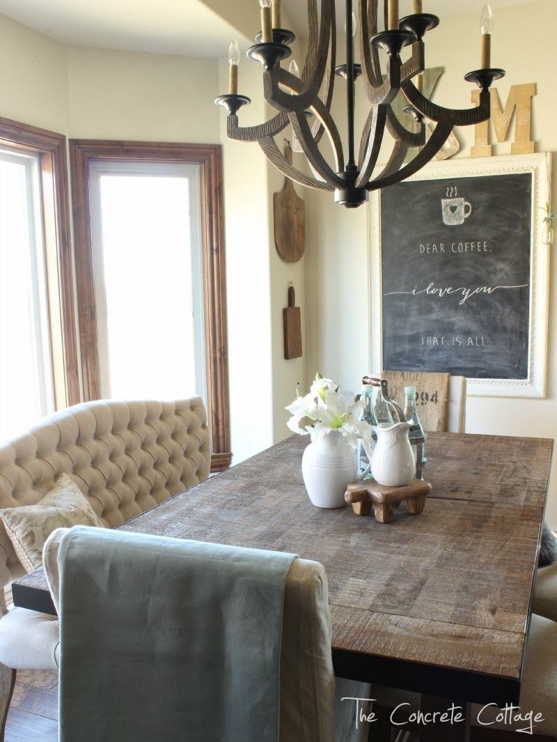 Dining Room Restyle: tufted bench, parsons chairs, rustic table, wood chandelier and a chalkboard. Getting there!