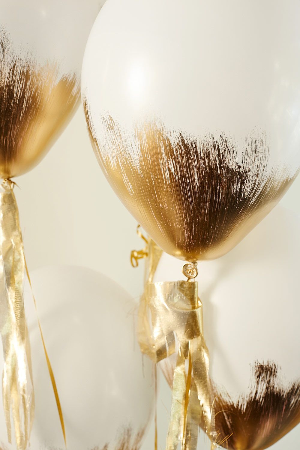 Gold brushed balloons are a perfect touch for a gilt celebration.