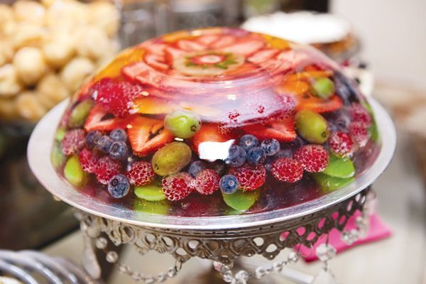 Layer fresh fruit in a bowl or jello form.  Pour a clear colored gelatin mixture made from Knox unflavored jello, but instead of