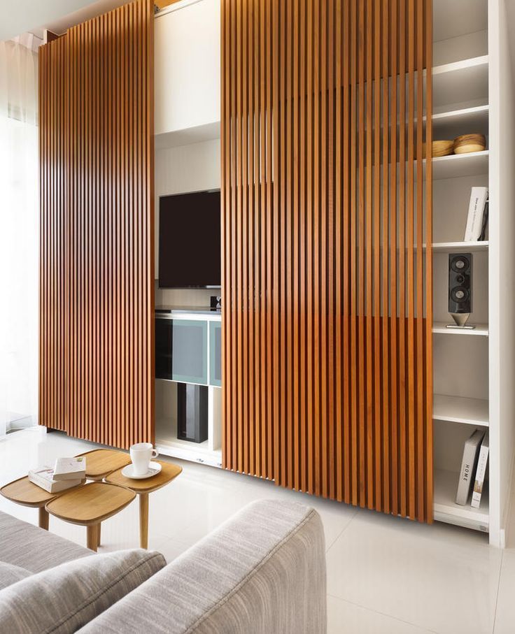 OMG! I am in love with this Slatted Wood and how it hides the entertainment center