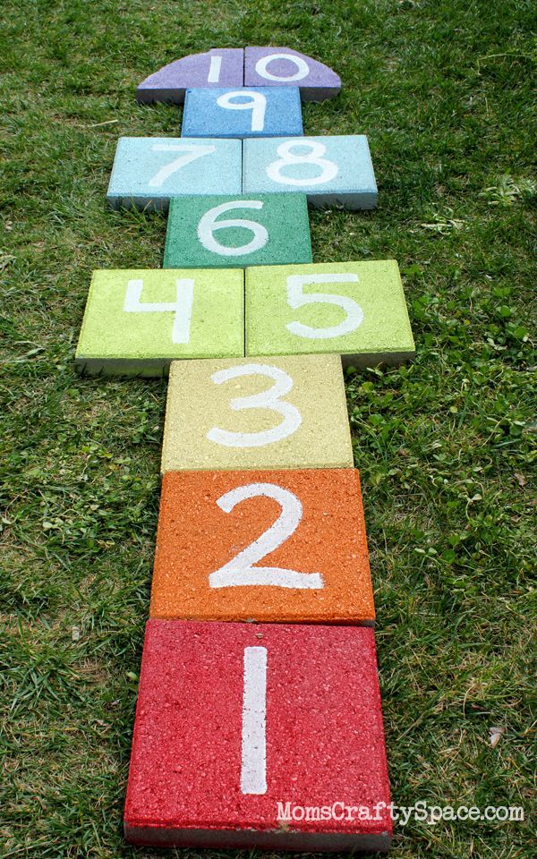 Super easy outdoor rainbow hopscotch – just use garden pavers and spray paint to add a fun splash of color to your yard!