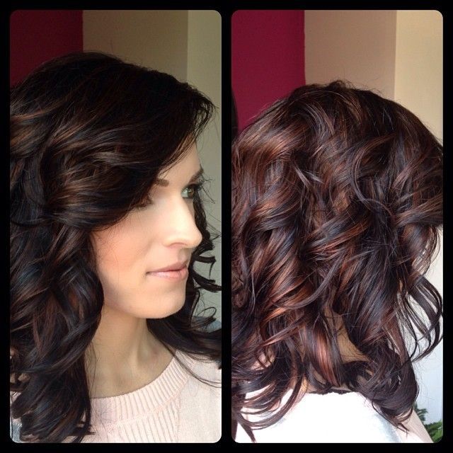 Super rich dark chocolate color with bright amber highlights, finished off with layers and flowing curls.
