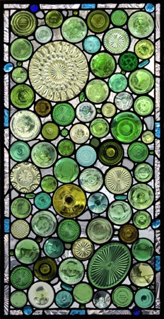 The bottoms of bottles and old glass serving dishes used to make windows.