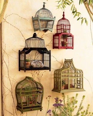 this would be awesome on a wall instead of shelving…. hobby lobby has a ton of random birdcages like these….