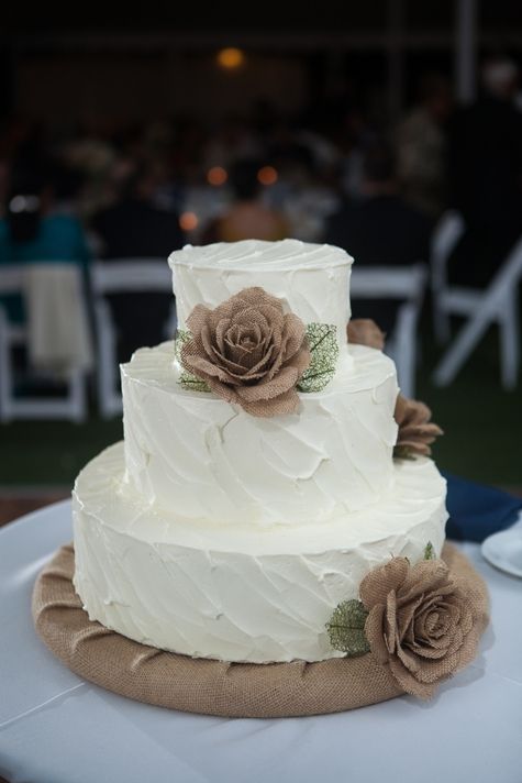 Three tiered white wedding cake with burlap flowers // Cake: A Spoon Fulla Sugar // Shelby Street Photography //