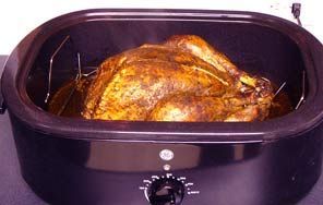 Tips on roasting a turkey in a roaster oven, including how to cook a perfect turkey and how to choose the right turkey roaster.