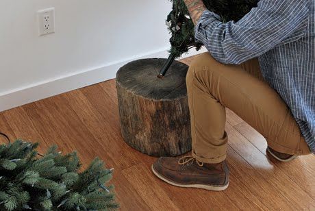 Tree Stump Stand for Artificial Tree…This looks so much nicer then the traditional tree skirts around tree stands. It probably
