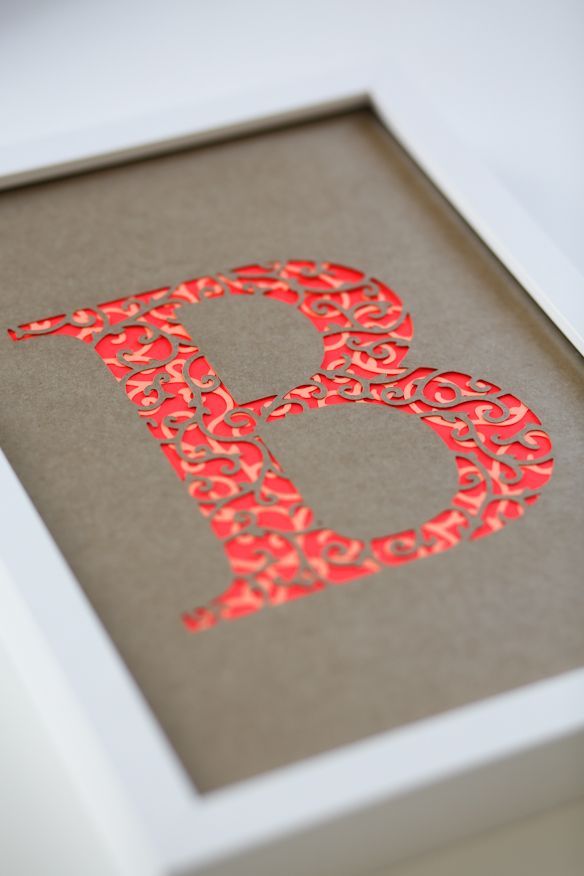 Try this using Silhouette Cameo.  Framed embellished initial. Monogram
