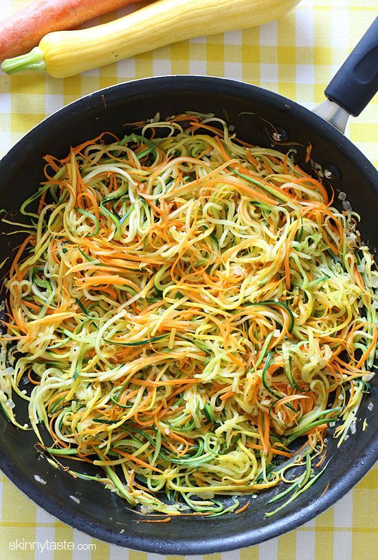 Zucchini, yellow squash and carrots cut into spaghetti like strands and sauteed with garlic and oil. Also great topped with your