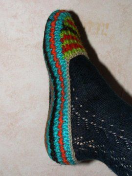 A slipper pattern that says do this till it fits your foot, crochet until it is so many cm tall- use any yarn and matching hook,