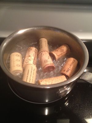 Before cutting corks boil them in water for around 10 minutes. This will stop them from crumbling or cracking when you cut or