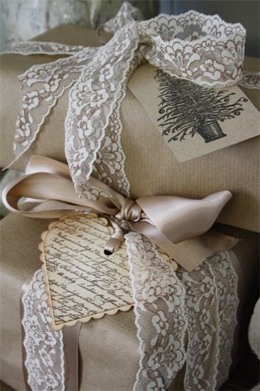 Brown gift wrapping paper with neutral ribbon and lace. Cute!
