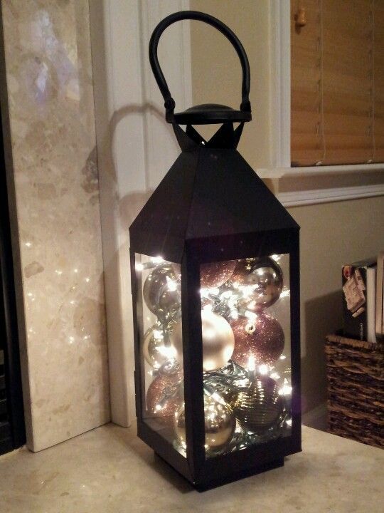 Christmas lantern. Just ball ornaments and a string of battery operated christmas lights. Deco going to do this lovely