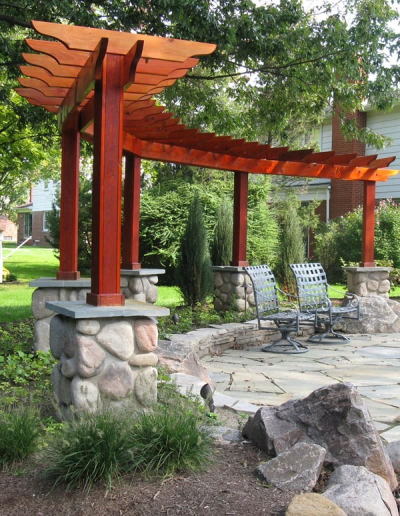 different shaped pergola .. makes a nice backdrop for the fire pit :)