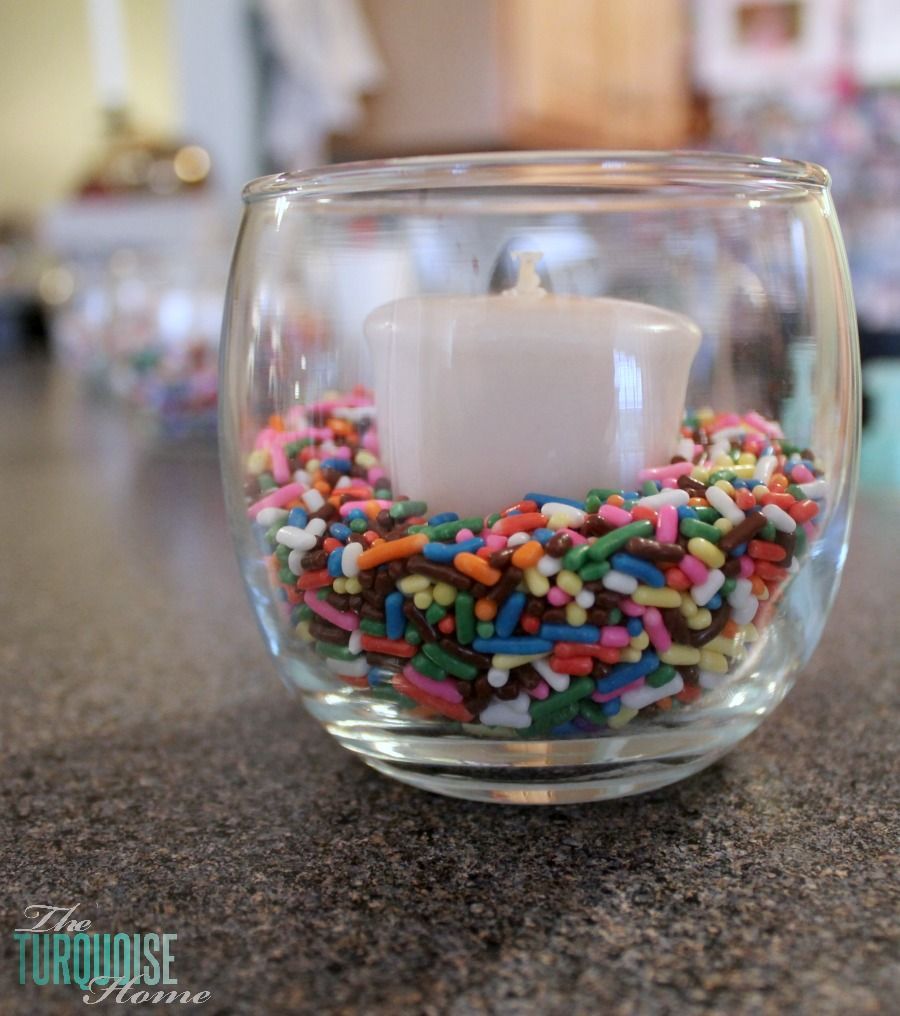 DIY  Party Decor :: Place a votive candle in a jar with some colorful sprinkles…..cheap and easy grad party table lights