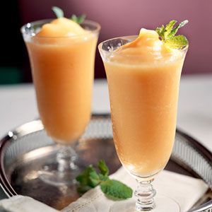 Mix frozen peach slices, ice, sugar, vodka, and peach schnapps in a blender until smooth – a fan fav
