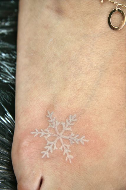 snowflake tattoo… I like the white ink. I want to do this color along with black for my panda tatoo.