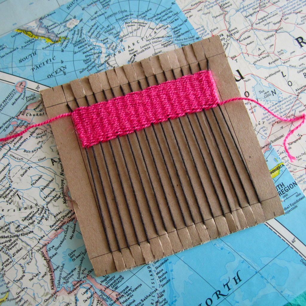 Weaving on cardboard loom – wouldn’t it be cool to make a rug like this?