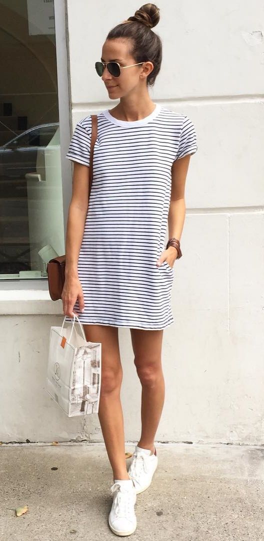 A striped t-shirt dress, white sneakers, and aviators.