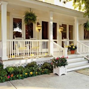 Classic front porch with ferns and flowers via Four Generations Under One Roof #porch