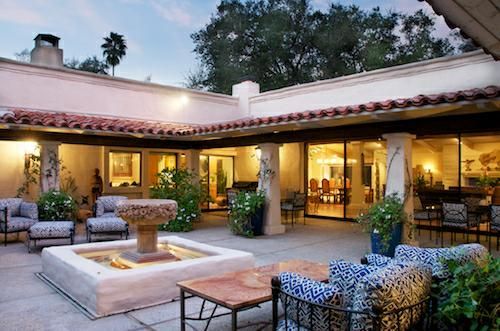 cliff may hacienda style homes. Gorgeous open courtyard. Large white French doors with paneled windows. Outdoor seating. Fountain