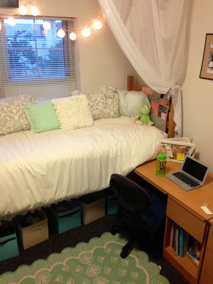Create a dorm bed canopy with curtains.