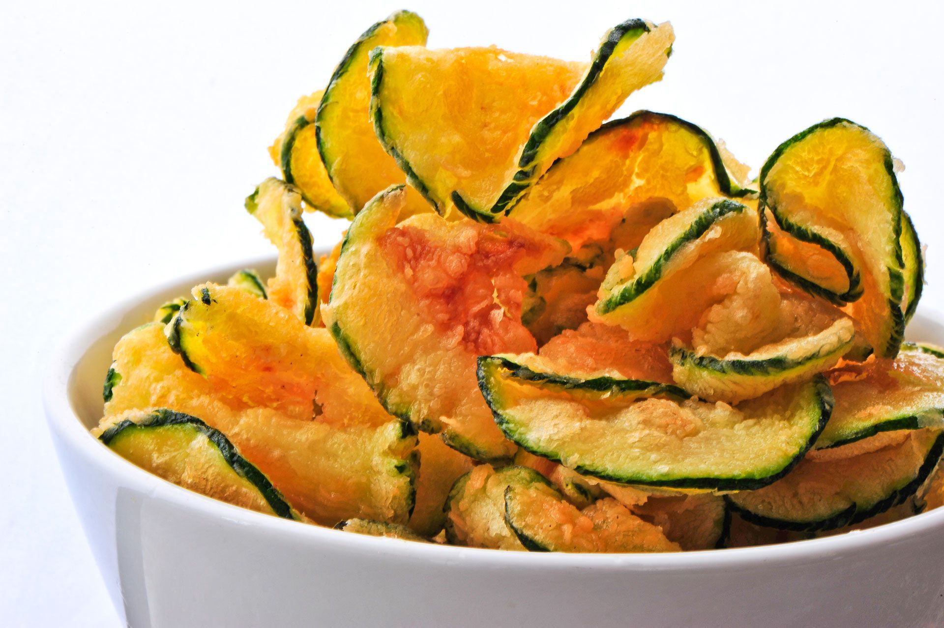 Cut a zucchini into thin slices and toss in 1 Tbsp olive oil, sea salt, and pepper. Sprinkle with paprika and bake at 450 degrees