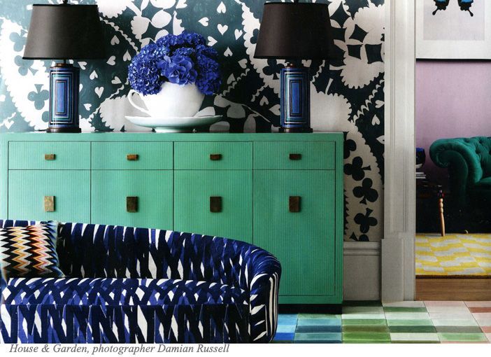 graphic dark wallpaper, graphic fabric, green sideboard, pink walls