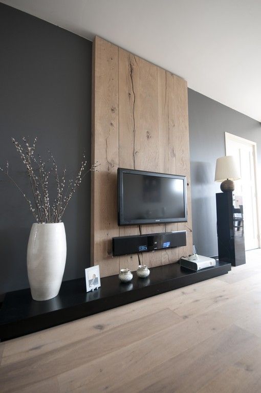 Great idea…paneling on the wall and mounting the tv to the paneling. Hides the cords and looks crisp and clean!