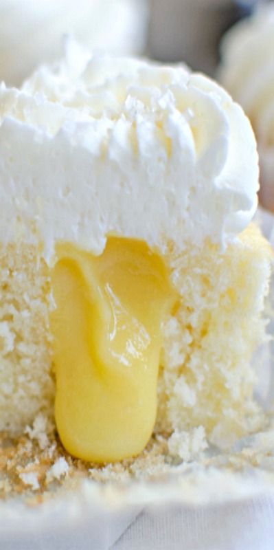 Lemon Curd Stuffed Cupcakes – a perfect vanilla cupcake stuffed with tangy lemon curd and topped with a slightly tart lemon