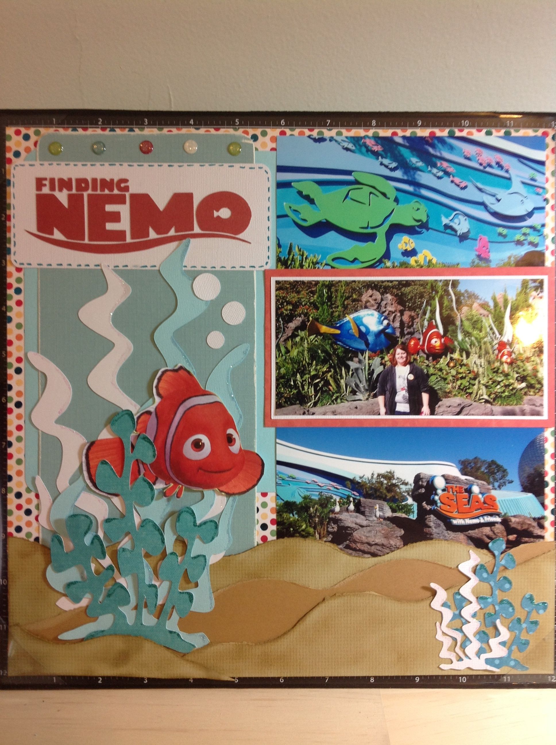 Nemo and Friends Epcot scrapbook page. Love the ‘sand’