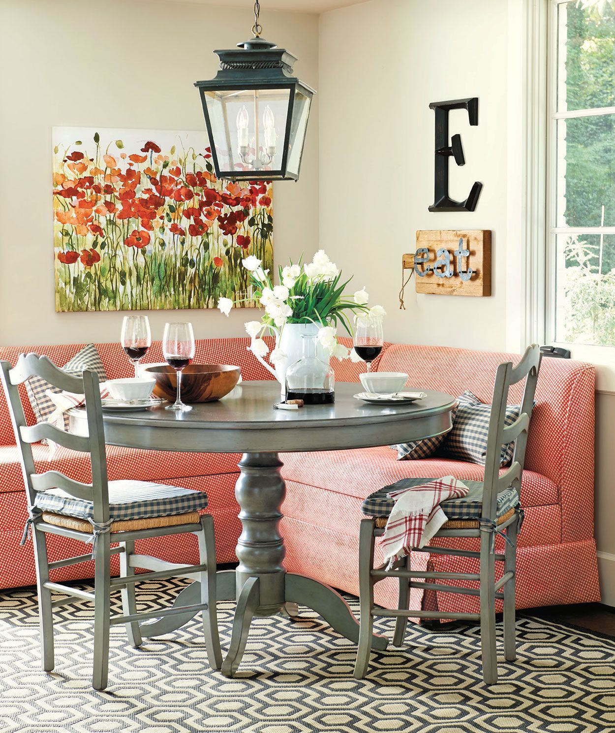 Not my fave colors, but love the idea of a small sectional as nook seating.