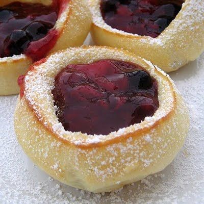 pancakes made in muffin/cupcake tins.  Only fill the tin 1/2 full and it will create the crater when it bakes.  Great brunch idea!