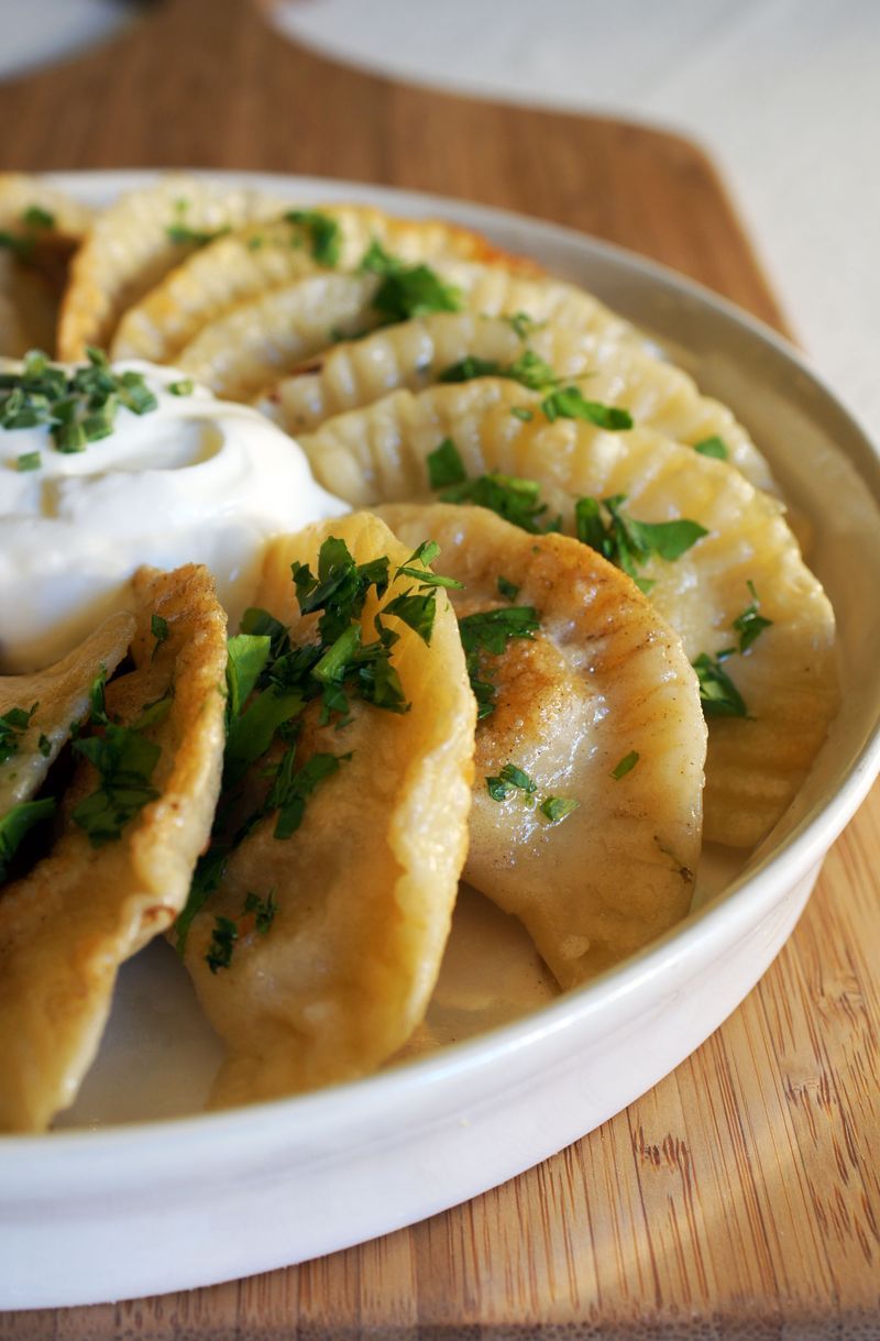 Pierogi ~ delicious bites from heaven. Potatos, garlic, cheese best served with a little sour cream.