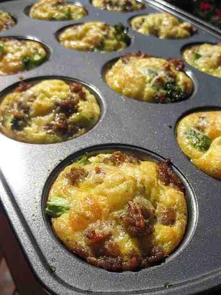 Scrambled eggs, bacon, cheese, & green onions in a muffin tin