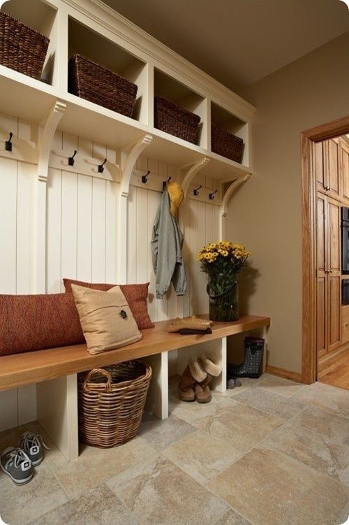 The mud room plan with nice floor, baskets & coat hooks. Like the natural wood bench top.