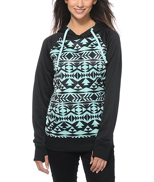 A trendy black and mint tribal print body is accented by a solid hood, raglan sleeves and trim, while the soft fleece lining