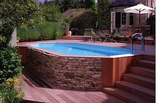 Above ground pool much cheaper just make it look ‘built in’. love the stone!!