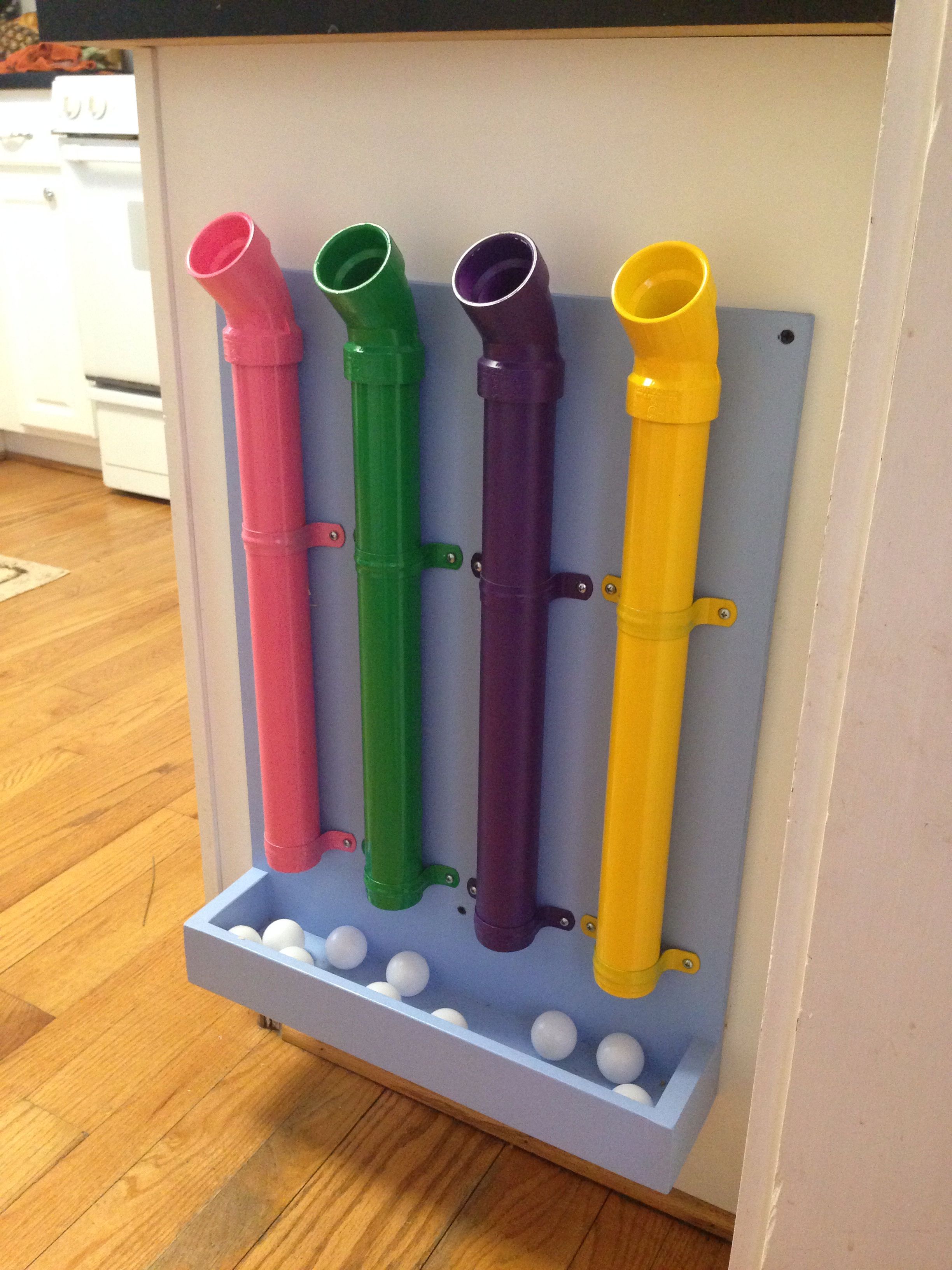 Chad’s kitchen counter toy to distract while cooking. Made of PVC piping and table tennis balls.