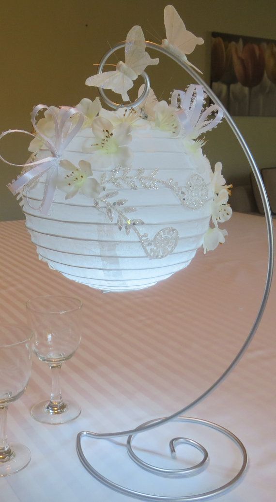 Paper lanterns decorated with silk flowers